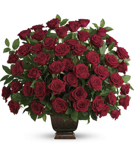 Sympathy bouquet of red roses presented in an urn